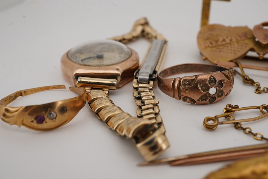 A group of jewels, comprising: a late 19th century 'Mizpah' brooch, stamped 9CT; a 9ct gold ring, British hallmark; a ruby and diamond ring, partial British hallmarks; a diamond stick pin, stamped 15CT, an aquamarine sti